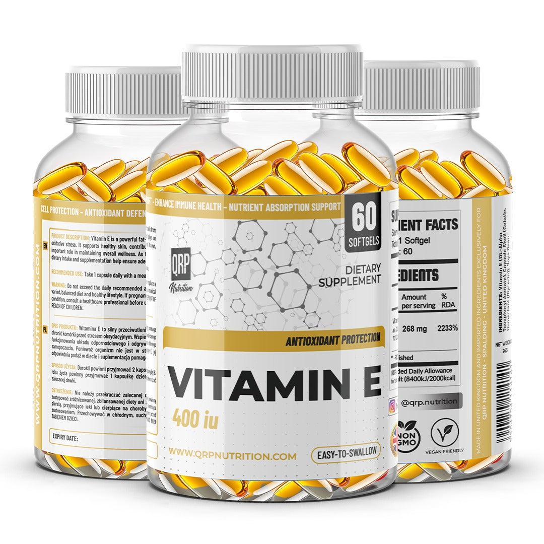 Three bottles of vitamin E supplements on a white background