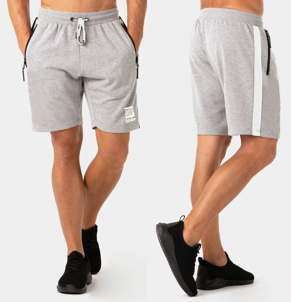 Gray shorts with black accents worn by a person on a white background