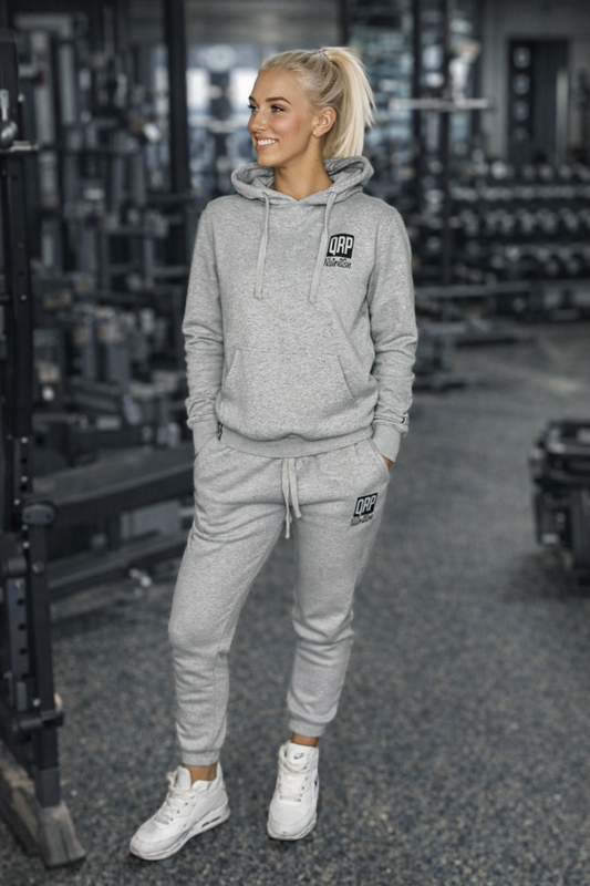 qrpnutrition grey tracksuit lady front gym photo happy lady